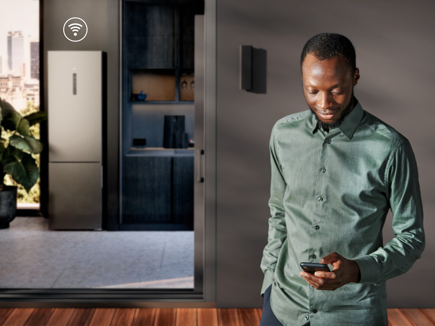 Man with phone in kitchen